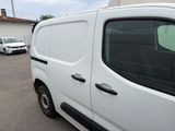 a white van that is parked in a parking lot