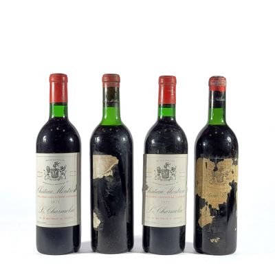 trois bouteilles de vin sont alignées sur une surface blanche