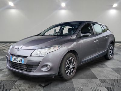 a picture of a silver car parked in a garage
