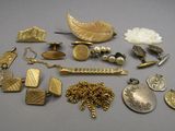 a lot of gold and silver jewelry on a table