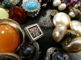 a table with many different types of jewelry on it