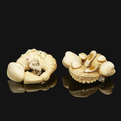 pair of carved ivory nets of a man and woman on a shell