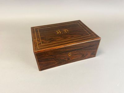 an old wooden box sitting on top of a white surface