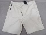 men ' s white shorts with black zippers on the side