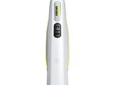 a close up of a mop on a white surface with a yellow handle