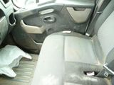 an image of a dirty car interior with the door open