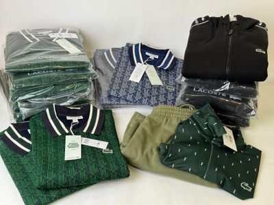 a lot of clothing that is sitting on a table