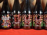 several bottles of wine are lined up on a table