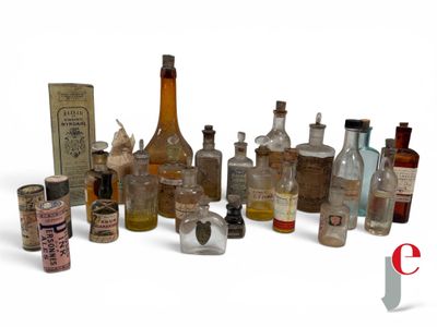 many bottles of different sizes and shapes on a white surface