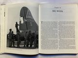 an open book with a picture of a military plane on it