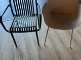 two chairs that are sitting next to each other on the floor
