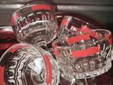 three empty wine glasses sitting on a red plate