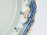 a plate with a floral design on it on a table