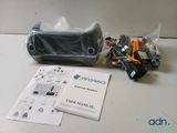 a bag of electronics and a book on the table