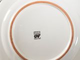 a plate that has a red and white design on it