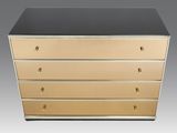 a black and gold chest of drawers with four drawers