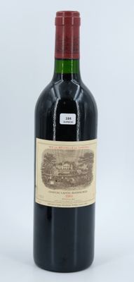 a bottle of wine that is sitting on a table