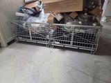 a metal cage filled with boxes and other items