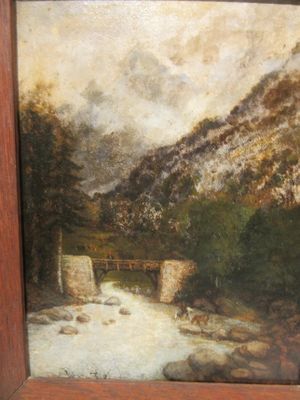 une photo d'un tableau représentant une rivière, dans un cadre en bois
