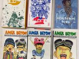 cinq livres pour enfants sont alignés sur une surface blanche