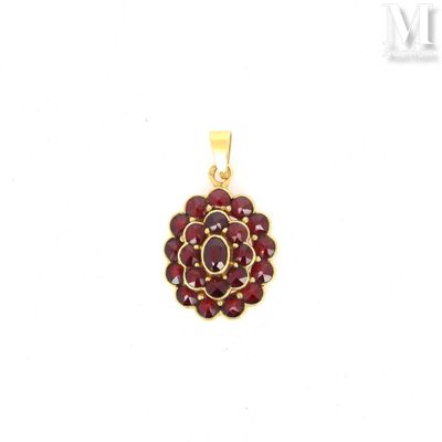 a close up of a red flower pendant on a white background
