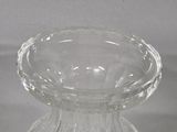 a glass vase that is sitting on a table