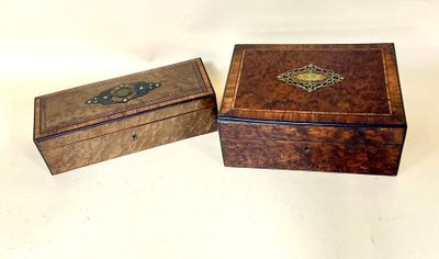 two small wooden boxes sitting on top of each other on a table