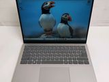 a laptop with a picture of two birds on the screen