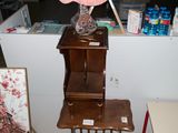 a table with a lamp on top of it in a room