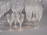 a lot of wine glasses sitting on a table