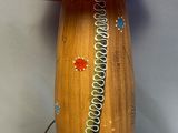 a wooden table with a red lamp on top of it