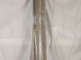 a roll of mesh on a white sheet on a table
