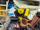 a pile of assorted construction toys in a bin