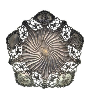 a silver plate that has a bunch of silver spoons in it
