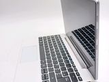 a laptop computer sitting on top of a white table