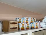 a shelf with many boxes of food on top of it