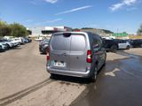a silver van that is parked in a parking lot