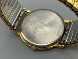 an image of a close up of a wrist watch on a table