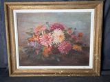 tableau représentant un bouquet de fleurs dans un cadre doré sur fond bleu