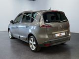 a picture of a silver car in a showroom