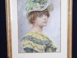 painting of a woman in a hat on a easel