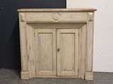 a small cabinet with a door on the top of it