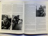 an open book with pictures of people in military uniforms