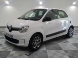 a picture of a small white car parked on a checkered floor