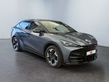the grey car is parked in a room with a black floor