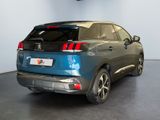 the rear end of a blue suv parked in a showroom