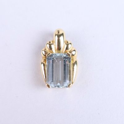 an image of a pendant with a blue stone in the center