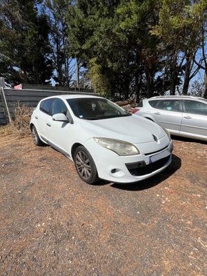 two cars that are parked next to each other in a lot