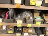 many boxes on the shelves of a store with labels on them