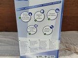 a box that is sitting on a bed with a white sheet